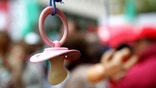 Toddlers are less likely to have asthma and itchy rashes if their parents cleaned their pacifiers by sucking on them when the kids were infants, a small new study suggests
